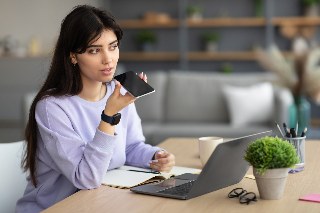 A user activates a voice assistant on their smartphone, demonstrating modern voice search behavior in everyday environments.